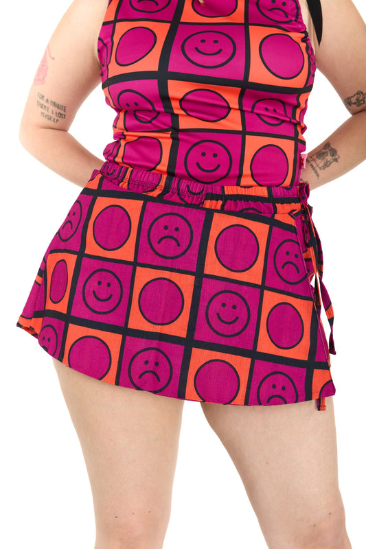 SHORT CAPA NARANJO-MAGENTA